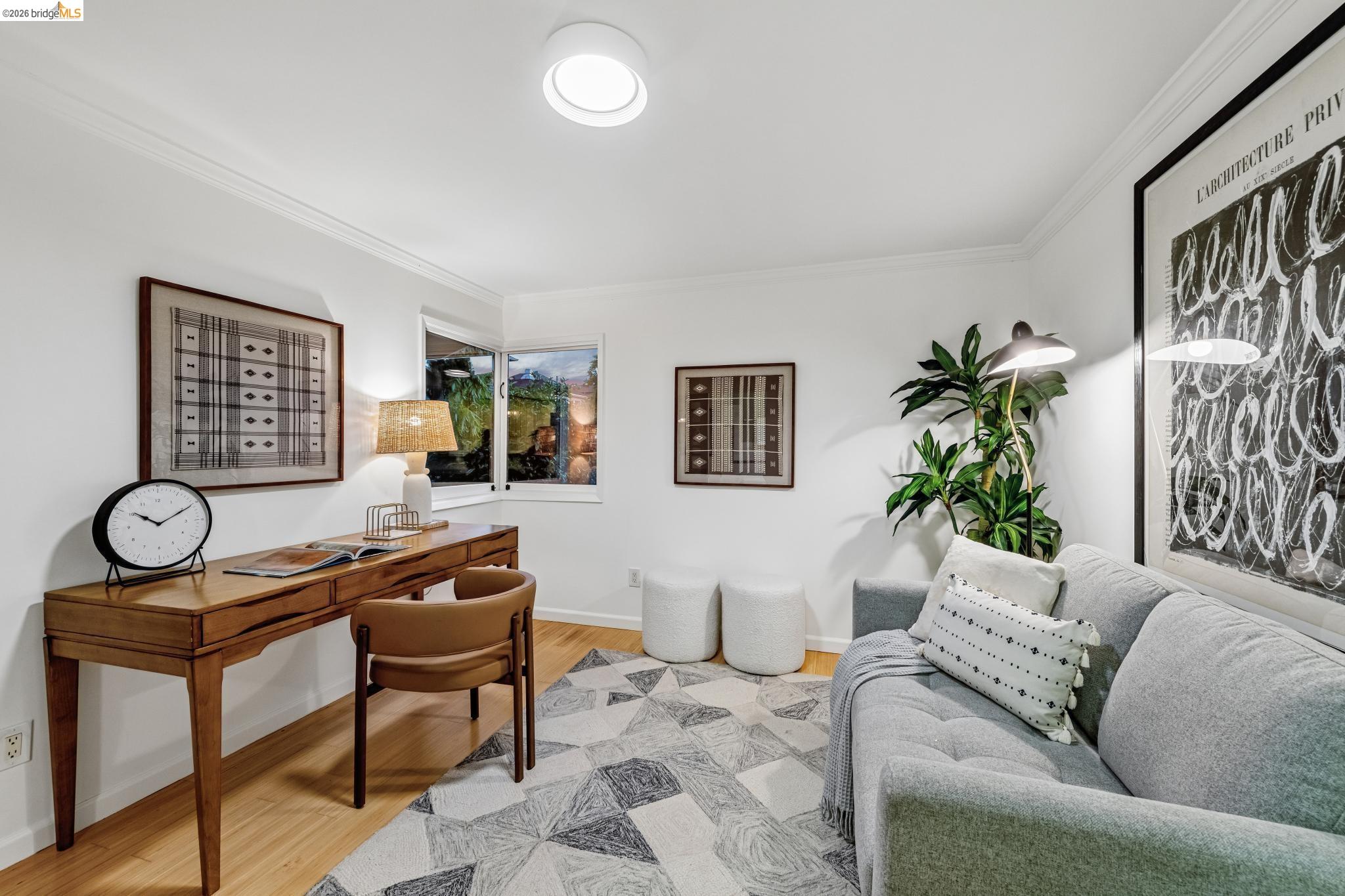 6521 Dover Street Berkeley, CA 94703 - Photo 69 of 80 Hardwood flooring and crown molding frame this versatile interior space, featuring a window and recessed ceiling lighting