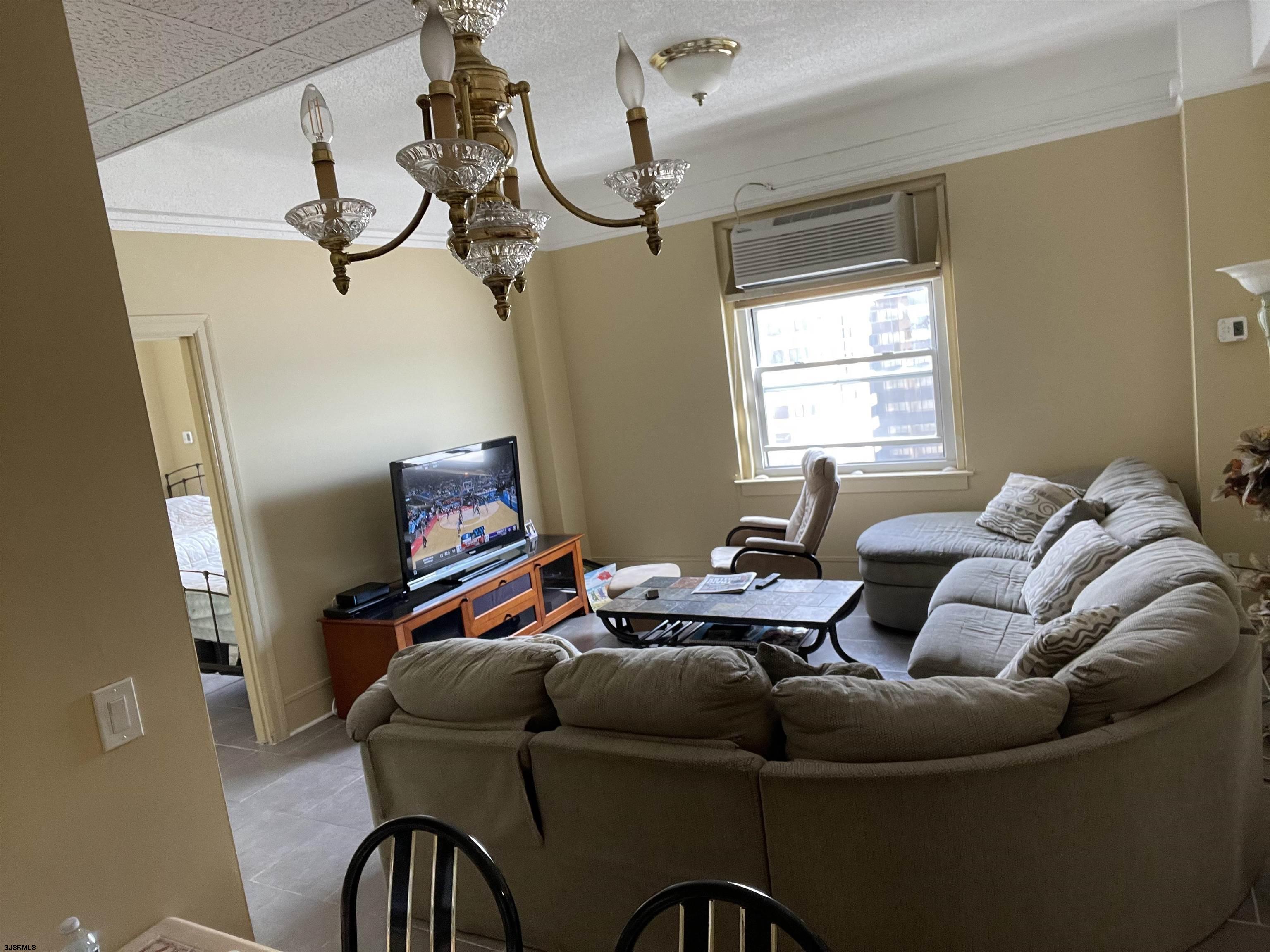 2715 Boardwalk, Unit 1209 Atlantic City, NJ 08401 - Photo 14 of 57 a living room with furniture and window