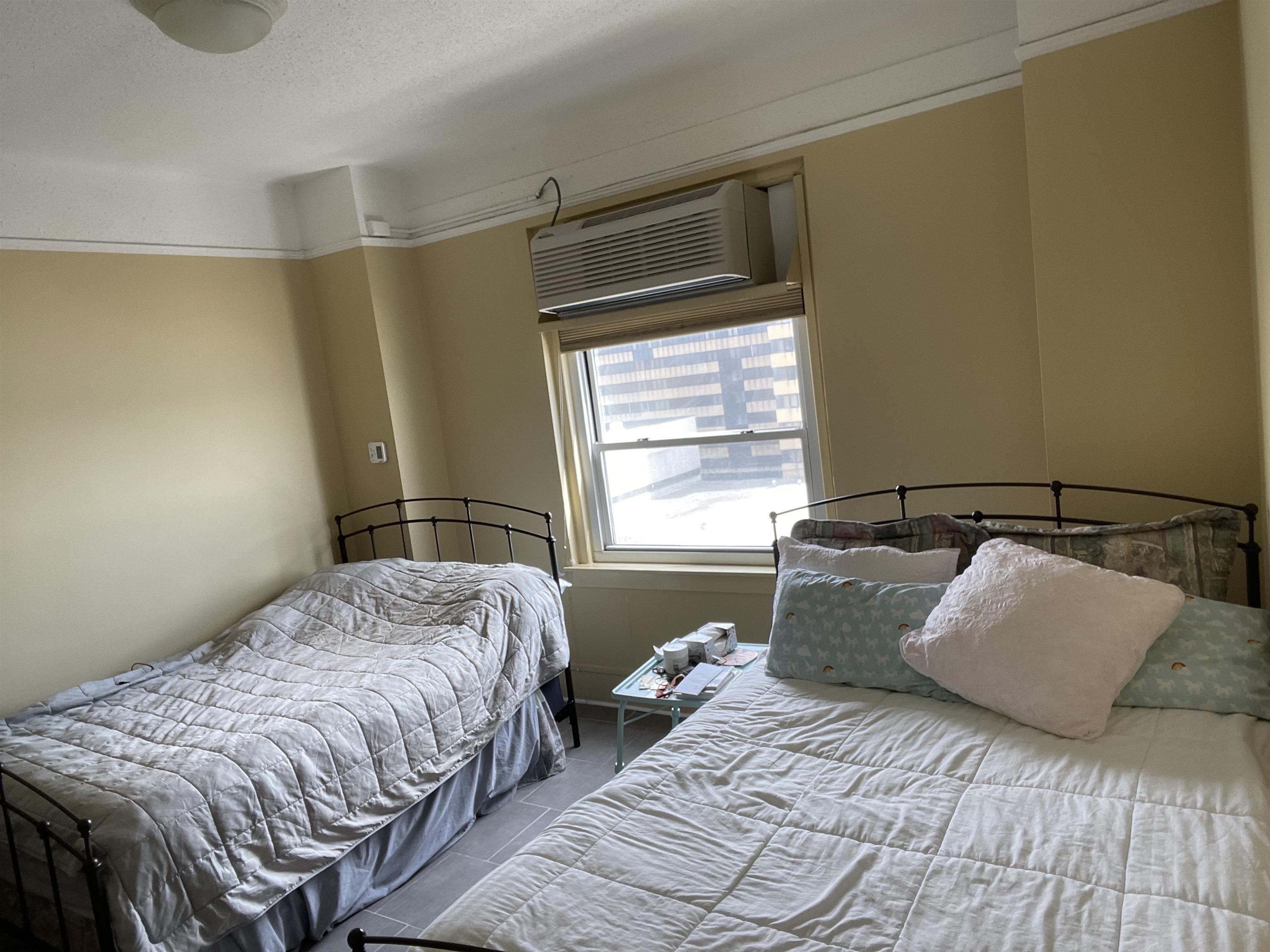 2715 Boardwalk, Unit 1209 Atlantic City, NJ 08401 - Photo 18 of 57 a bedroom with a bed and a window