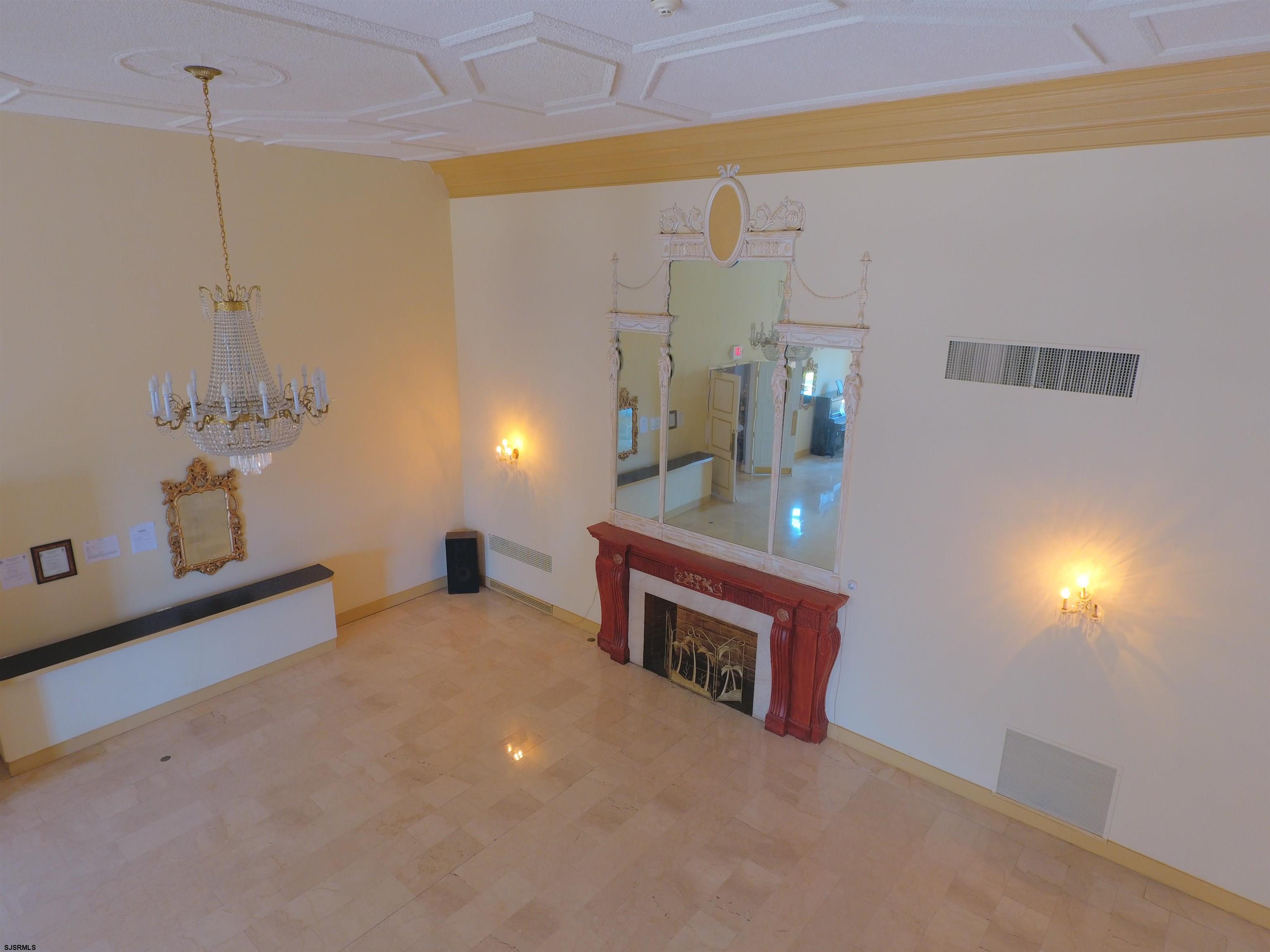 2715 Boardwalk, Unit 1209 Atlantic City, NJ 08401 - Photo 29 of 57 a view of a room with a table and chairs