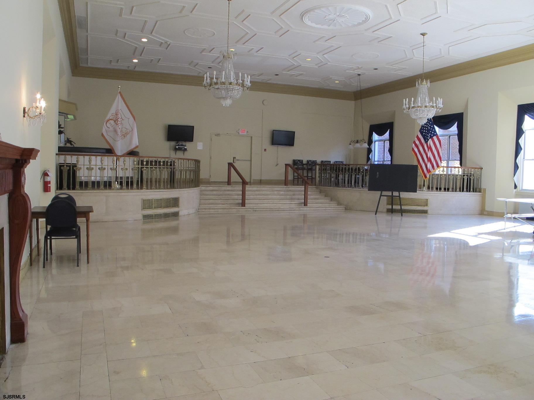 2715 Boardwalk, Unit 1209 Atlantic City, NJ 08401 - Photo 37 of 57 a living room with couches and kitchen view with wooden floor