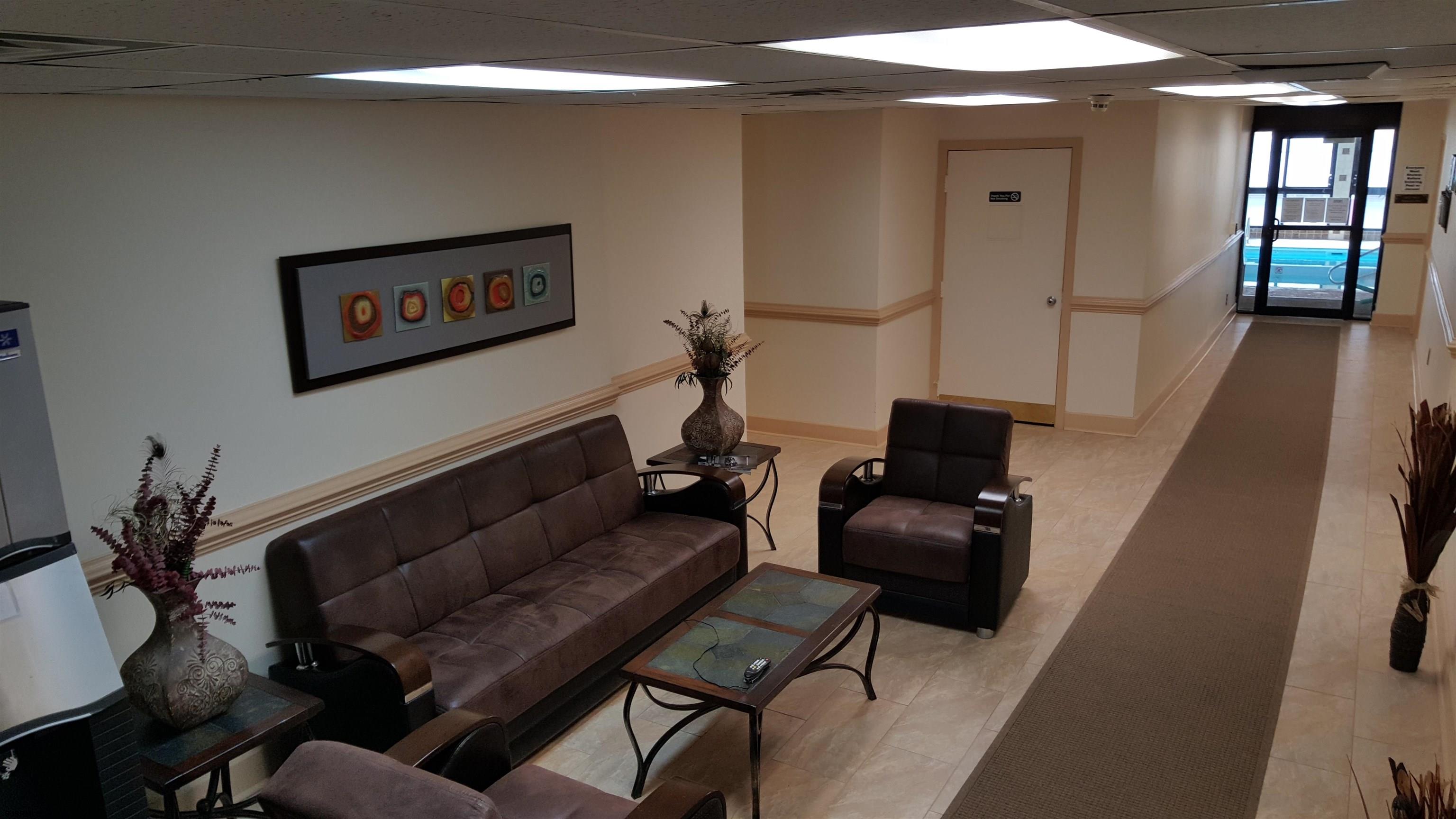 2715 Boardwalk, Unit 1209 Atlantic City, NJ 08401 - Photo 49 of 57 a living room with furniture and wooden floor