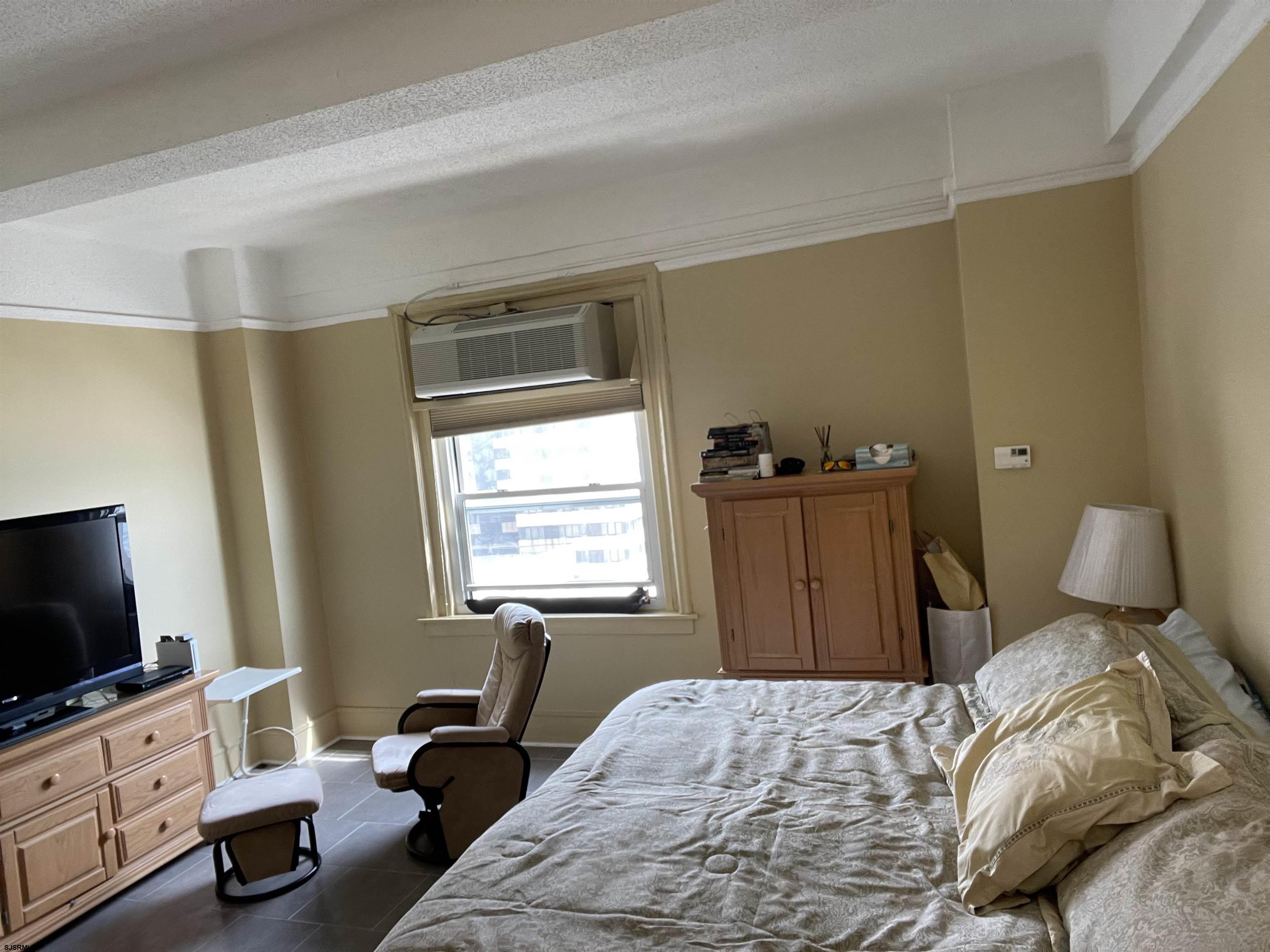 2715 Boardwalk, Unit 1209 Atlantic City, NJ 08401 - Photo 5 of 57 a bedroom with a bed and flat tv screen