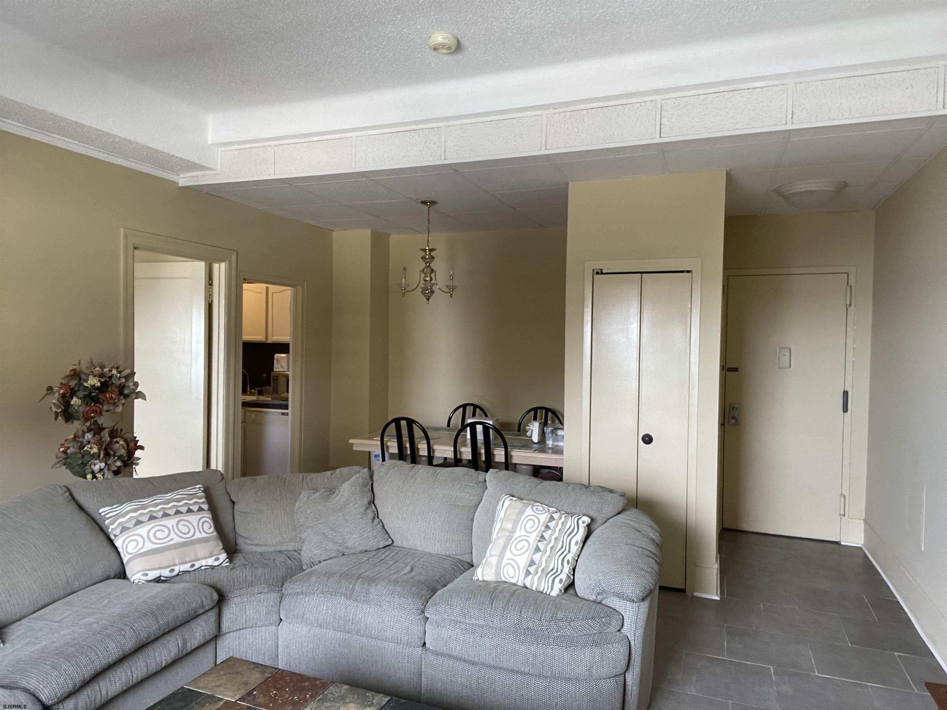 2715 Boardwalk, Unit 1209 Atlantic City, NJ 08401 - Photo 8 of 57 a living room with furniture and a potted plant