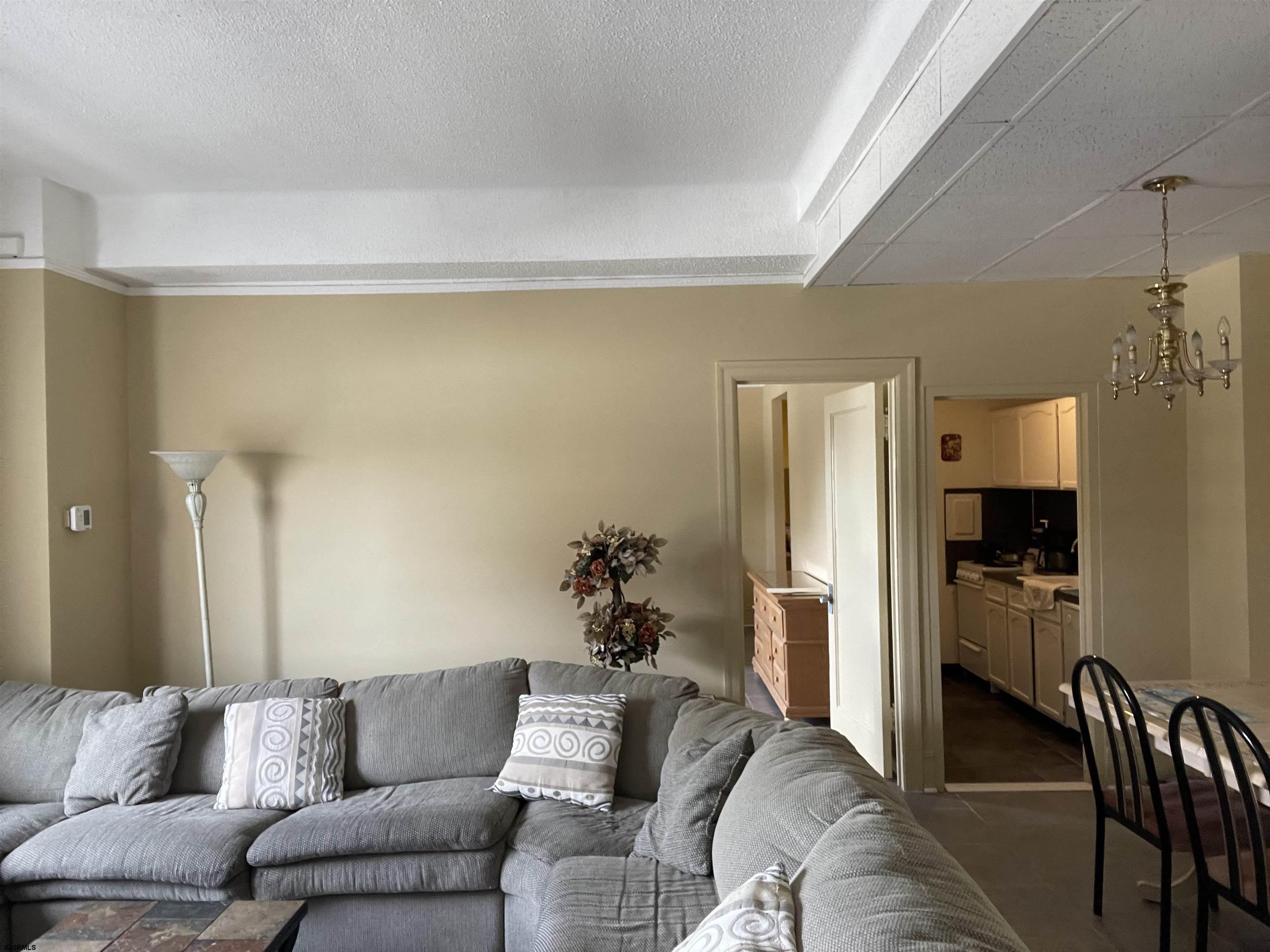 2715 Boardwalk, Unit 1209 Atlantic City, NJ 08401 - Photo 9 of 57 a living room with furniture and a couch