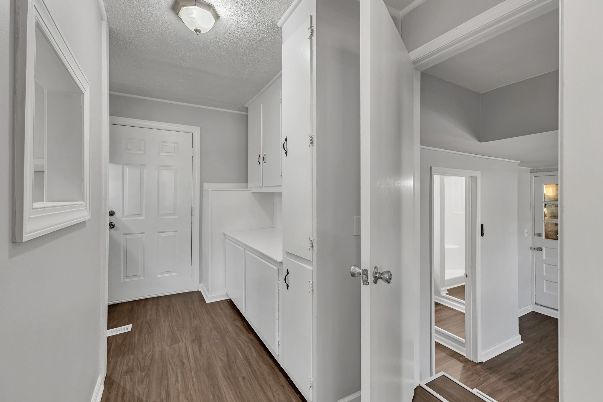 845 Richards Road Antioch, TN 37013 - Photo 11 of 24 a view of a hallway with wooden floor and staircase