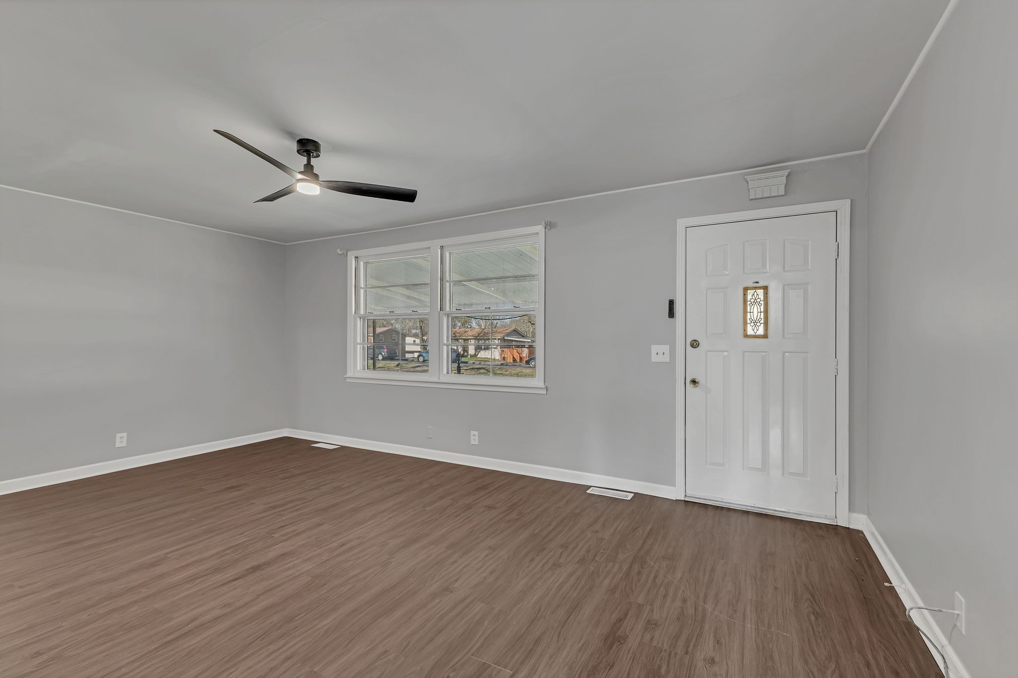 845 Richards Road Antioch, TN 37013 - Photo 5 of 24 an empty room with wooden floor and windows