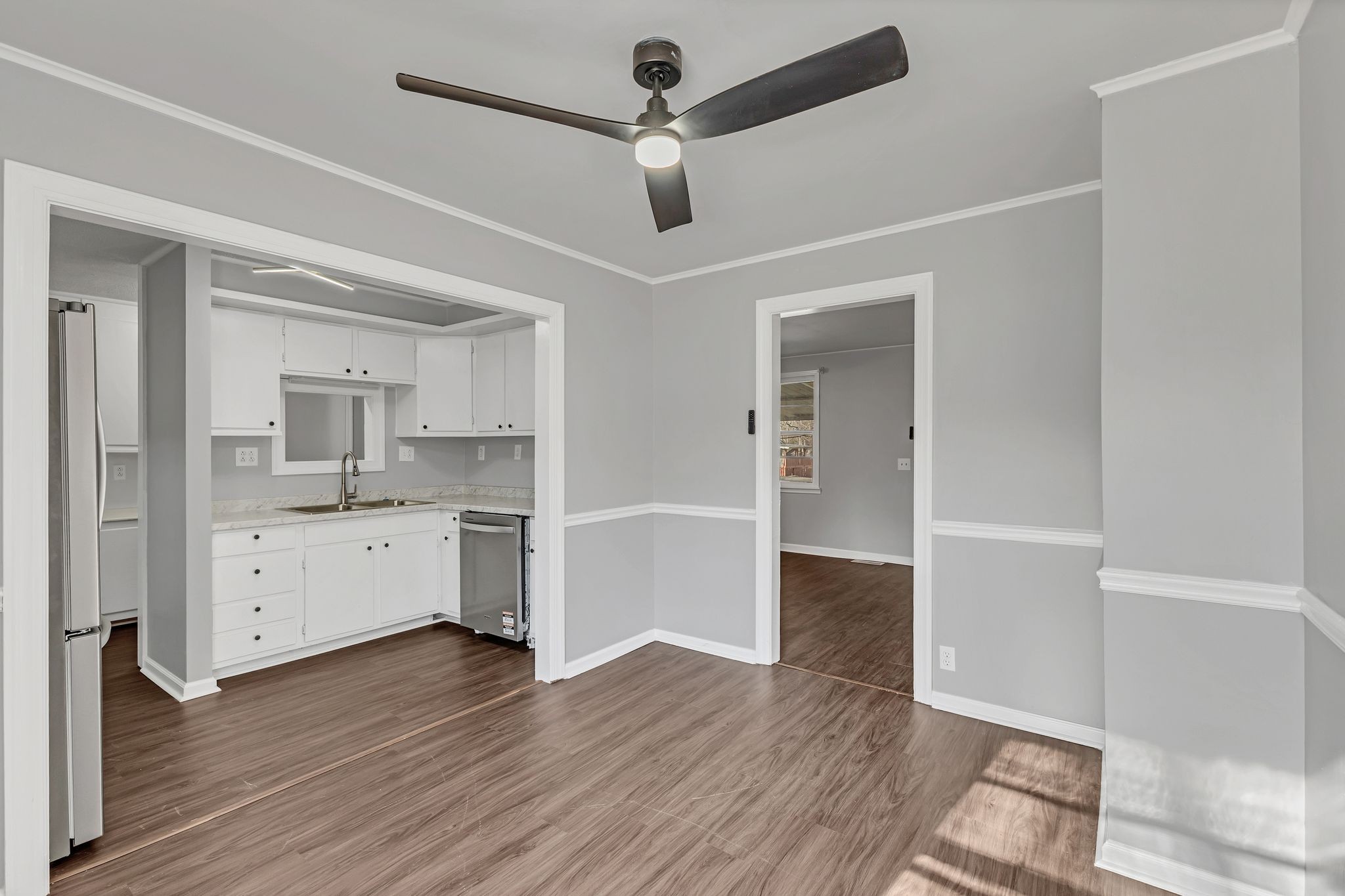 845 Richards Road Antioch, TN 37013 - Photo 8 of 24 a view of a kitchen with wooden floor and a ceiling fan