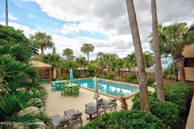 a view of a balcony with furniture