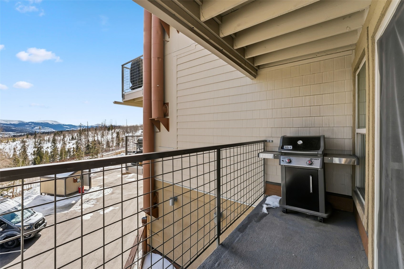 7124 Ryan Gulch Road, Unit 204 Wildernest, CO 80498 - Photo 11 of 36 a view of a balcony with furniture