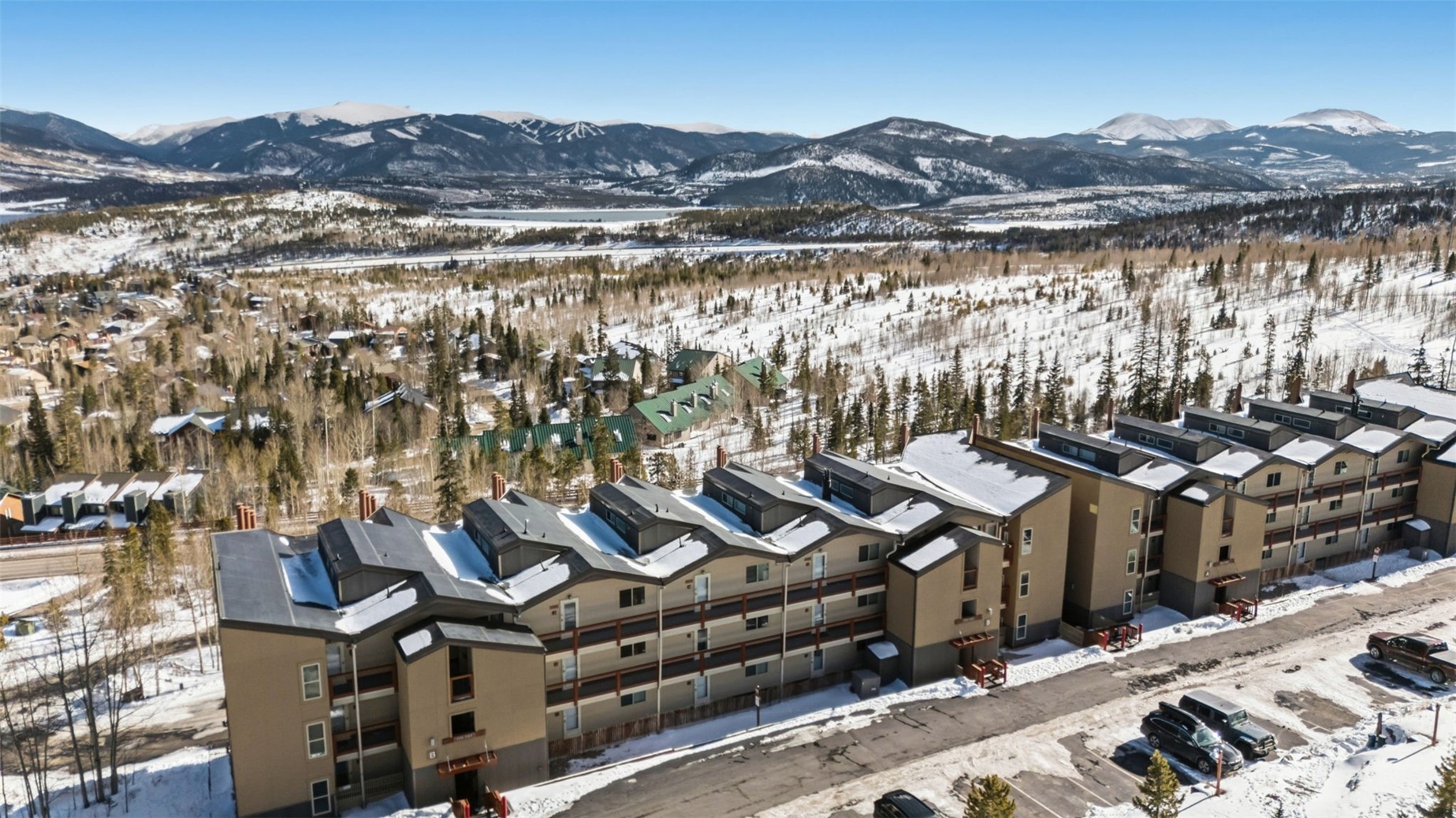 7124 Ryan Gulch Road, Unit 204 Wildernest, CO 80498 - Photo 34 of 36 Snowy aerial view featuring a mountain view