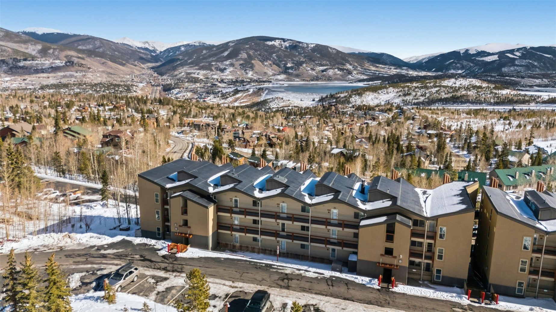 7124 Ryan Gulch Road, Unit 204 Wildernest, CO 80498 - Photo 35 of 36 Snowy aerial view with a mountain view