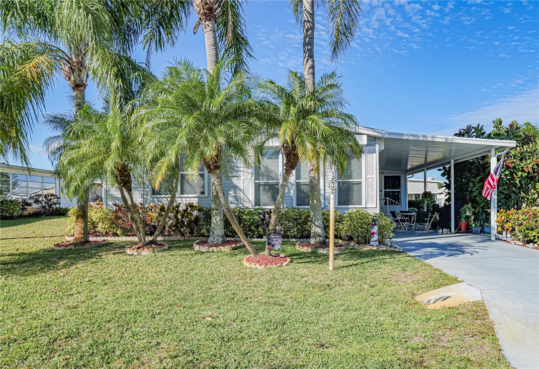 7648 Kyak Court, Unit Q16 Sebastian, FL 32976 - Photo 3 of 34 a view of a house with backyard and sitting area