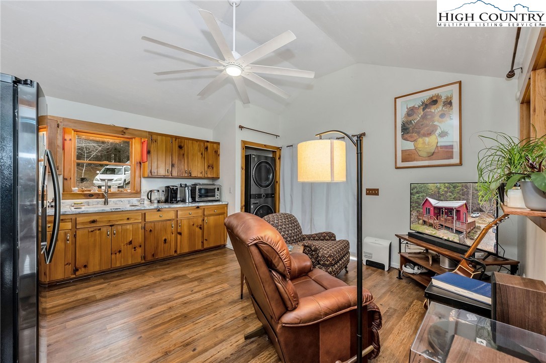 508 Curly Q Drive Crumpler, NC 28617 - Photo 21 of 39 a very nice looking living room with a large window wooden floor and furniture
