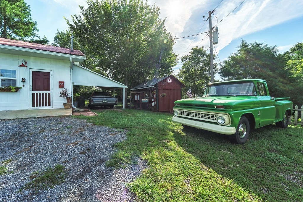 622 Lower Bogard Road Newport, TN 37821 - Photo 25 of 34 a view of a house with a yard and large trees
