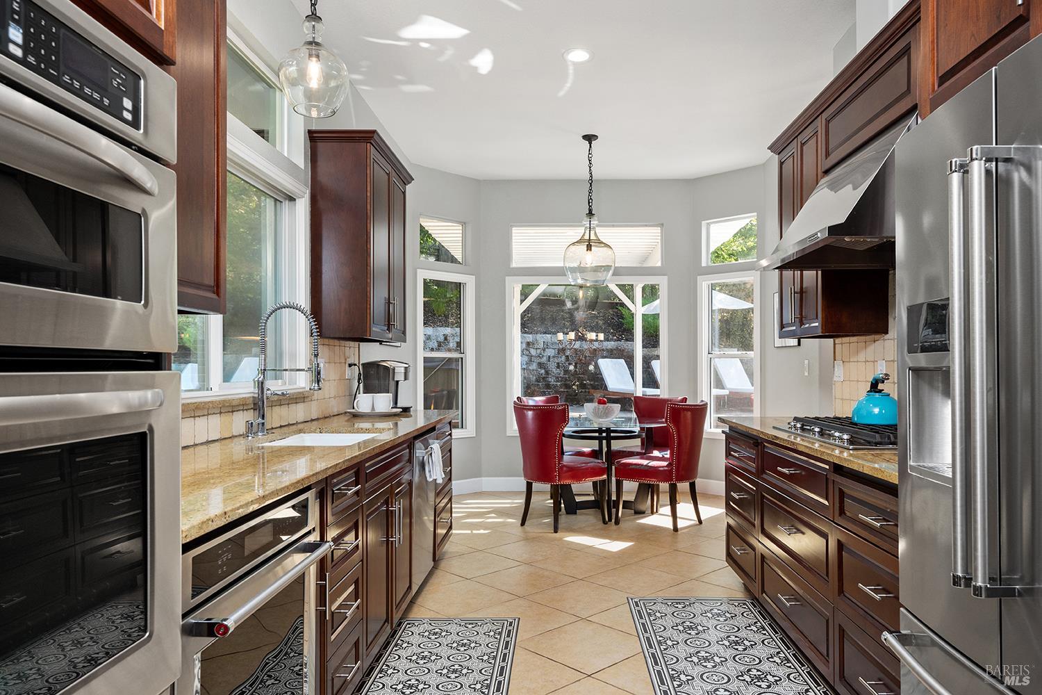 3991 Haven Court Sebastopol, CA 95472 - Photo 13 of 60 a kitchen with granite countertop a sink stainless steel appliances and furniture