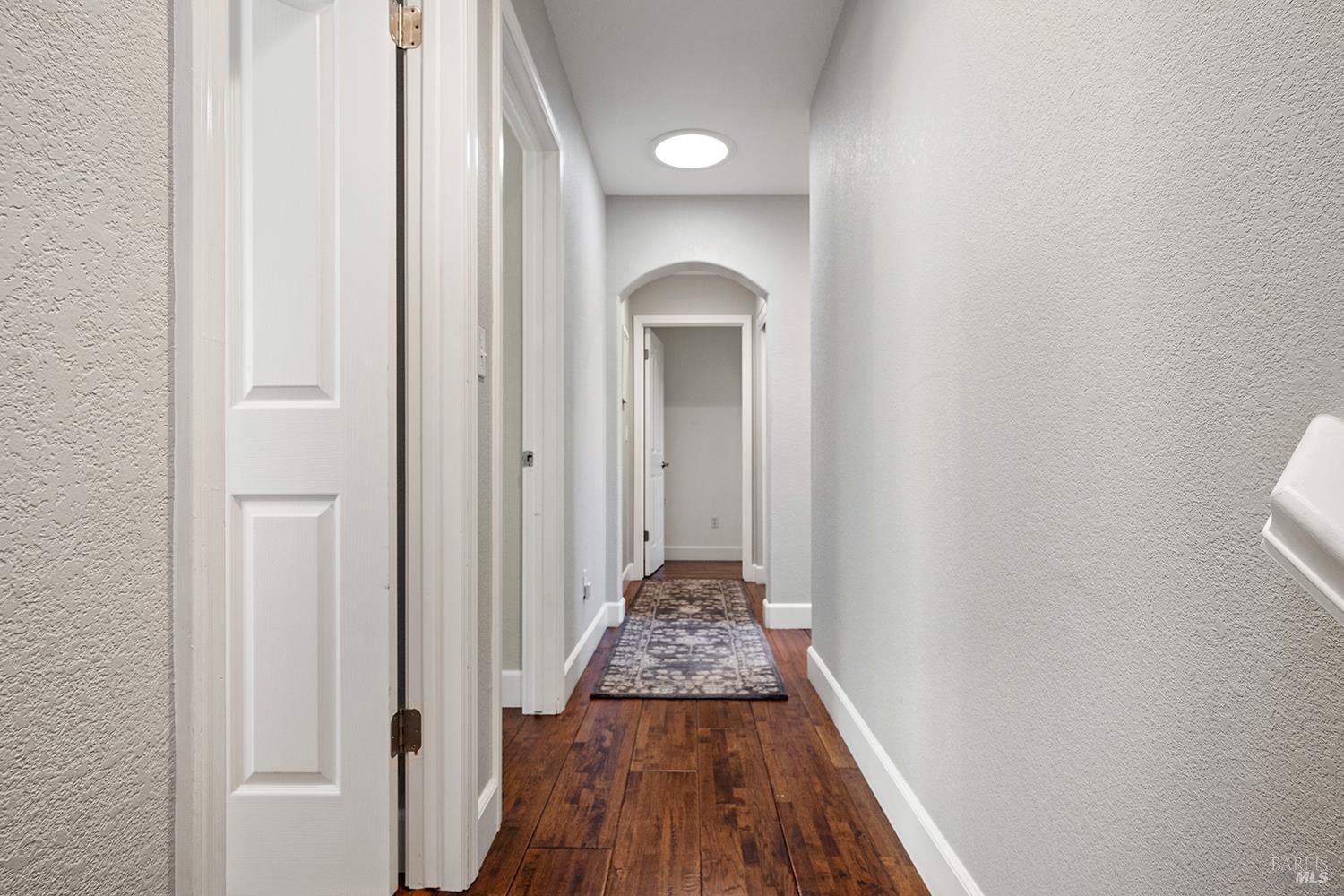 3991 Haven Court Sebastopol, CA 95472 - Photo 20 of 60 a view of a hallway with wooden floor and staircase