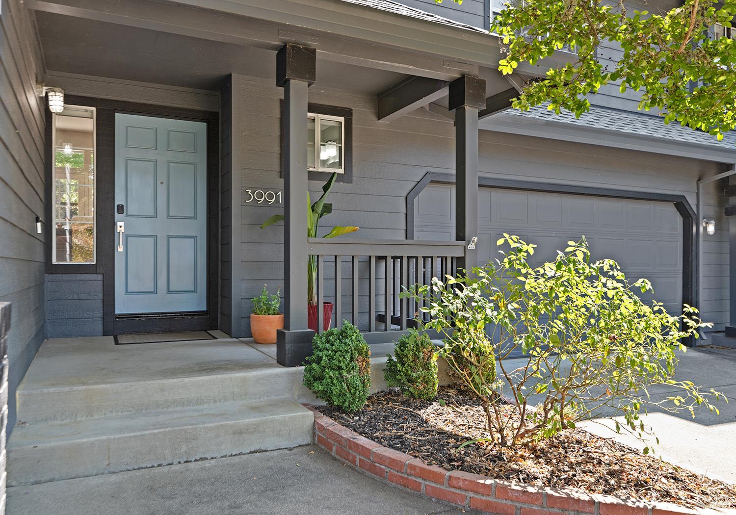 3991 Haven Court Sebastopol, CA 95472 - Photo 3 of 60 a front view of a house with lots of flowers