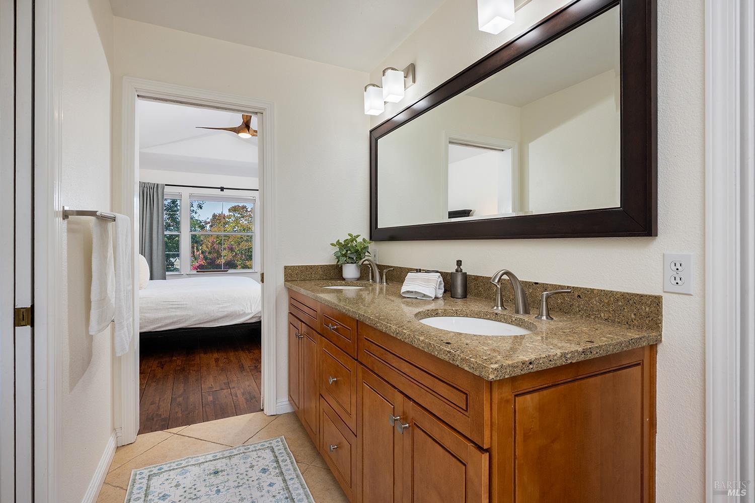 3991 Haven Court Sebastopol, CA 95472 - Photo 34 of 60 a en suite bathroom with a granite countertop sink and a mirror