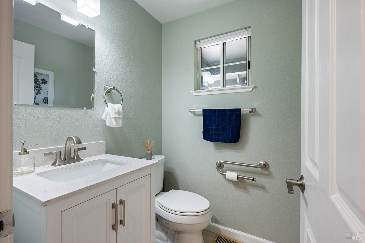 3991 Haven Court Sebastopol, CA 95472 - Photo 35 of 60 a bathroom with a toilet a sink and mirror