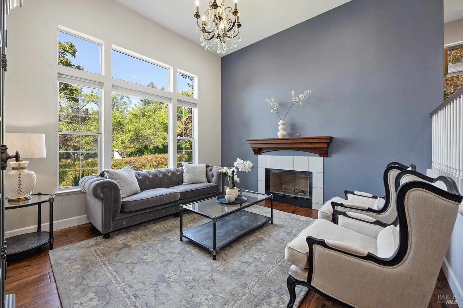 3991 Haven Court Sebastopol, CA 95472 - Photo 8 of 60 a living room with furniture a chandelier and a fireplace