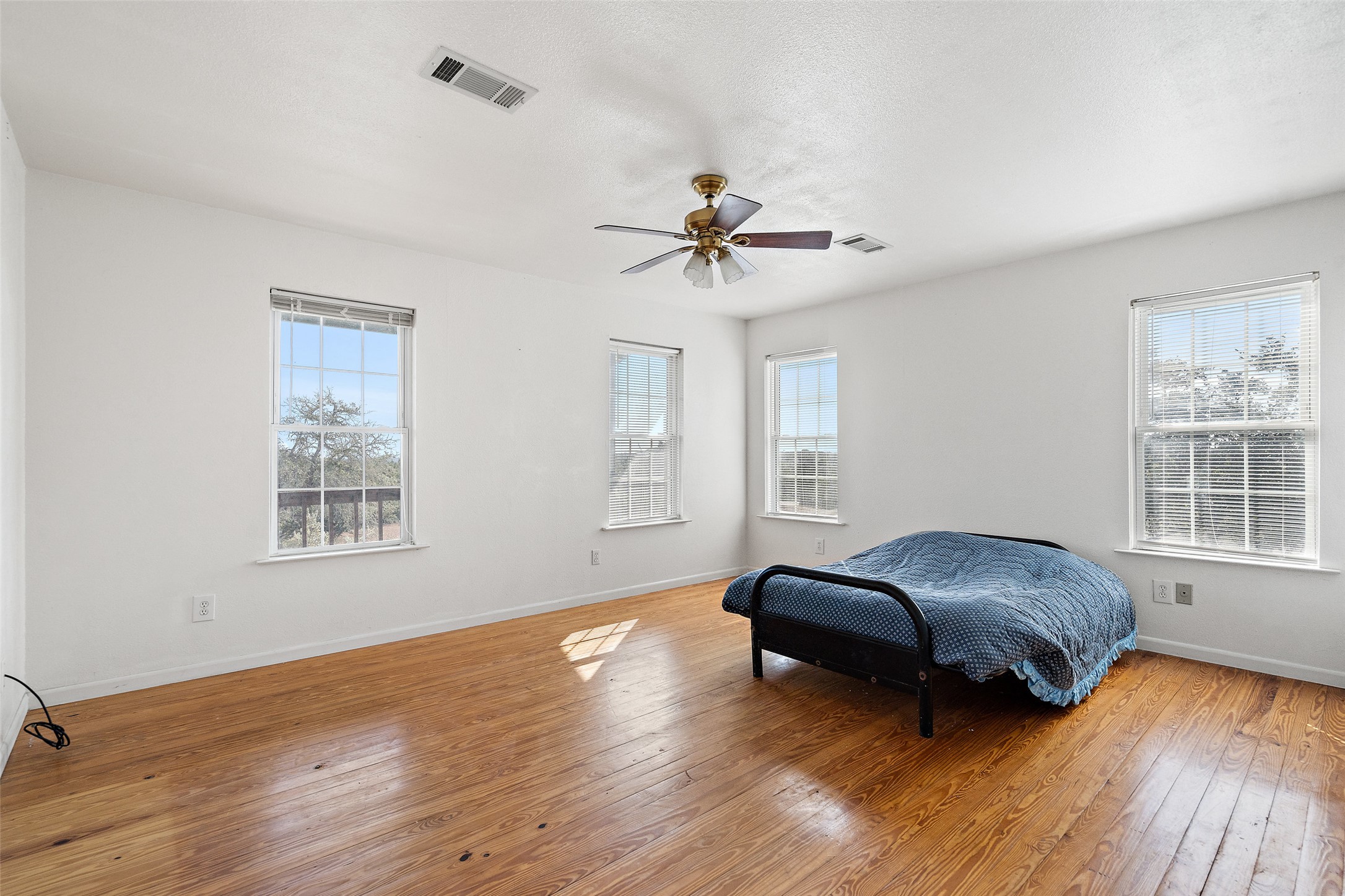 1401 Pursley Road Dripping Springs, TX 78620 - Photo 10 of 35 Sitting room with light wood-type flooring, plenty of natural light, and ceiling fan
