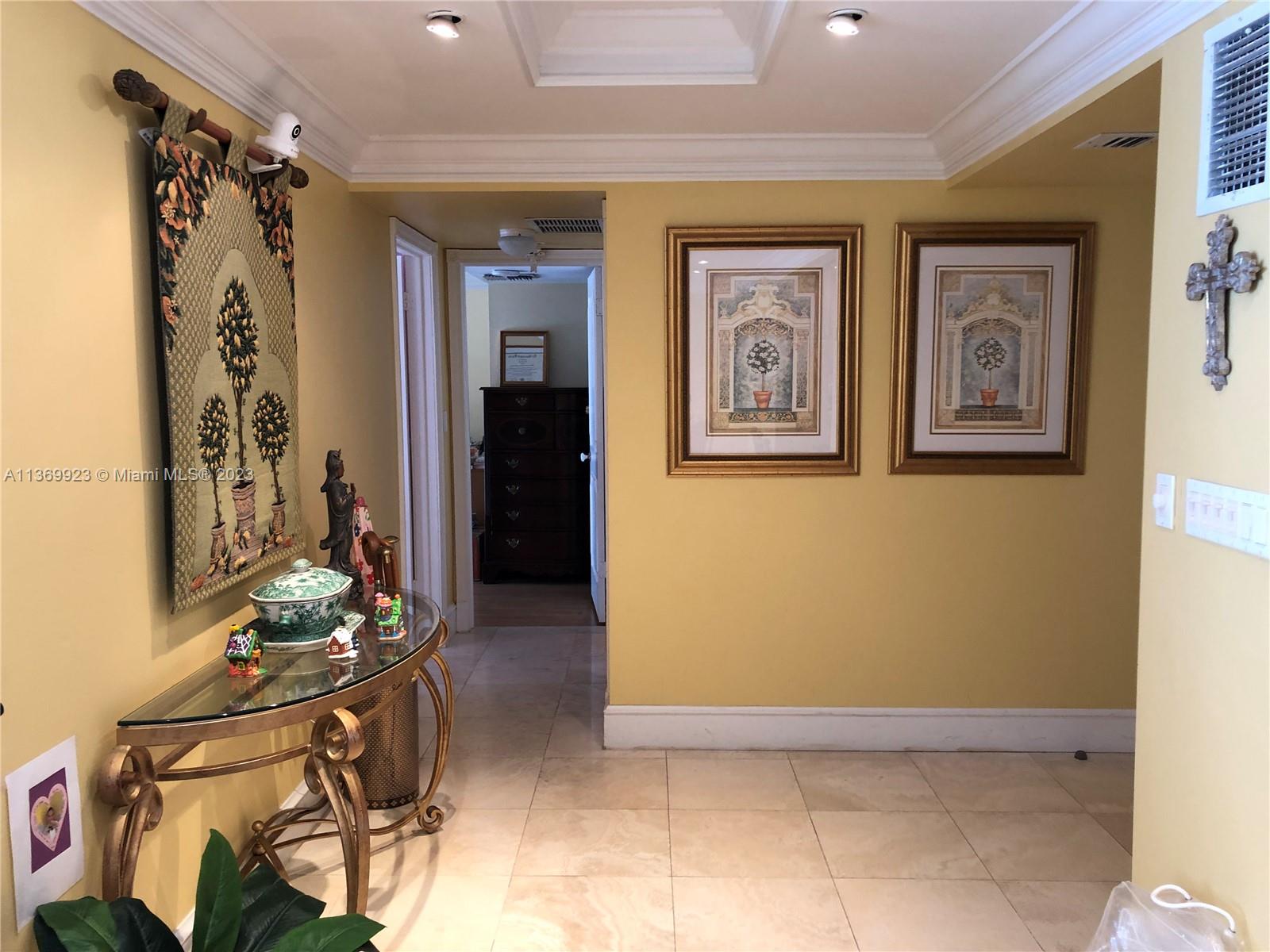 199 Ocean Ln Drive, Unit 705 Key Biscayne, FL 33149 - Photo 4 of 7 a view of an entryway with wooden floor