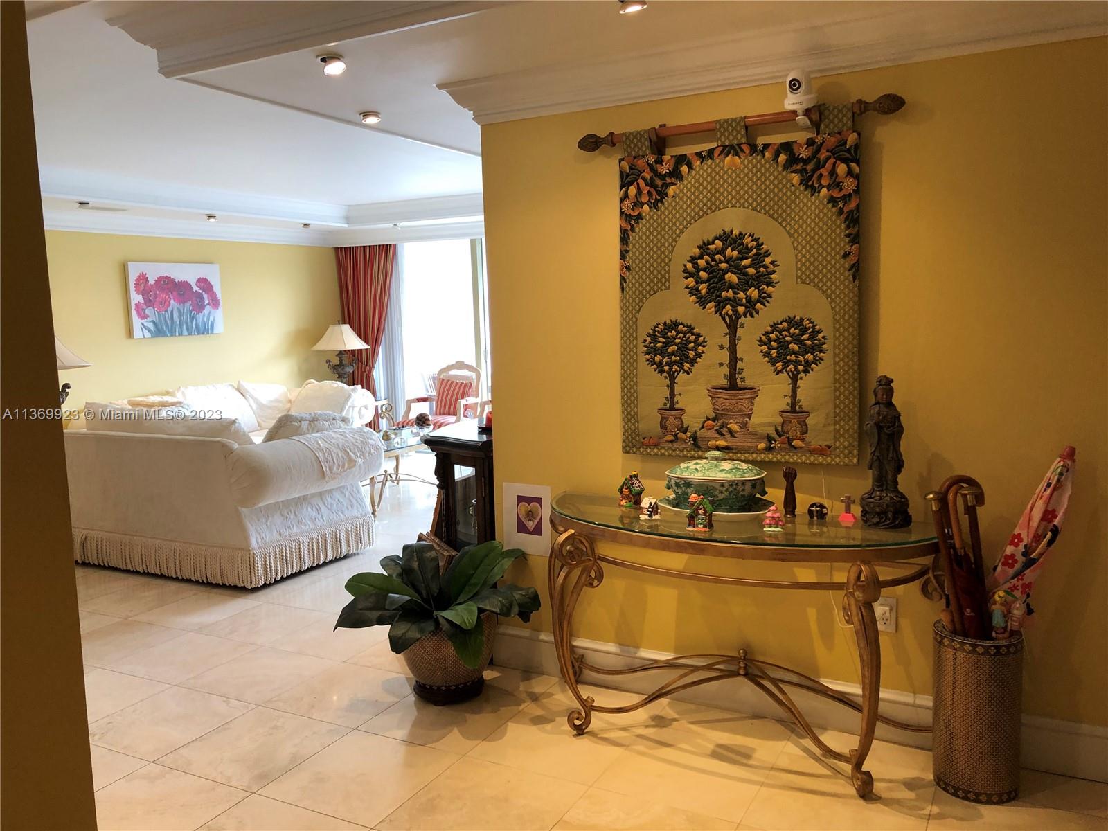 199 Ocean Ln Drive, Unit 705 Key Biscayne, FL 33149 - Photo 5 of 7 a room with gym equipment and a mirror