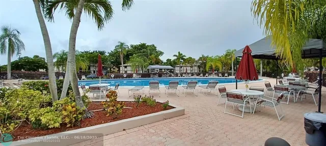 a view of a lake with palm trees