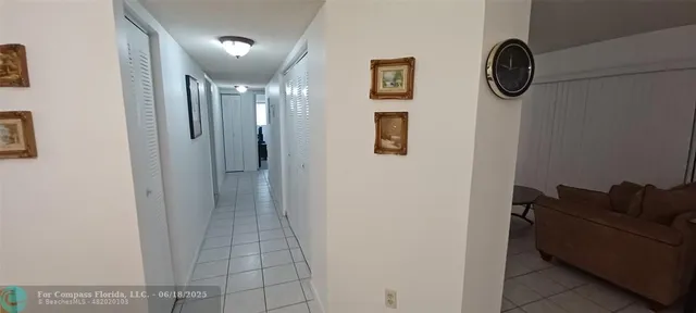 a bathroom with a shower and mirror