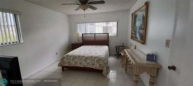 a bedroom with a bed and a chair