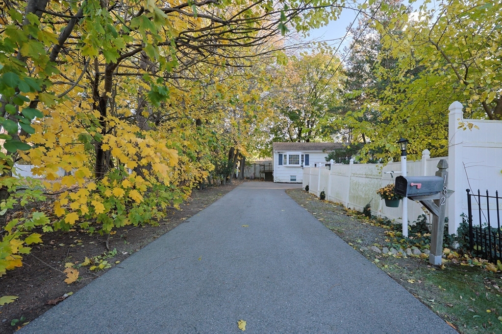182 Summer Street Framingham, MA 01701 - Photo 2 of 30 a view of a house with a yard and garage