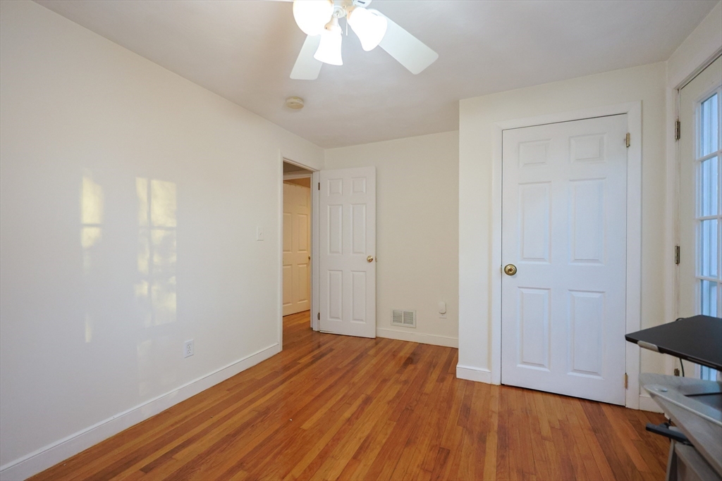 182 Summer Street Framingham, MA 01701 - Photo 21 of 30 an empty room with wooden floor and windows