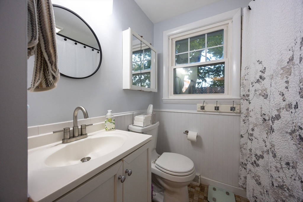 182 Summer Street Framingham, MA 01701 - Photo 22 of 30 a bathroom with a sink and a mirror