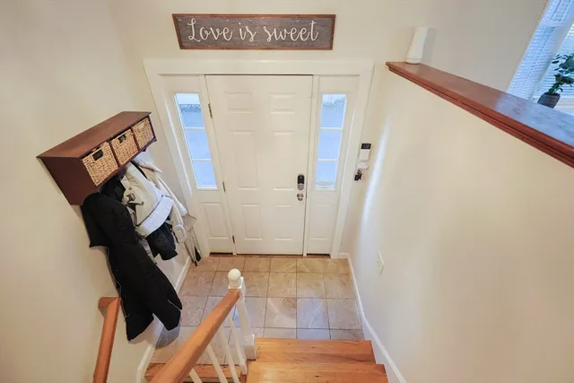 a view of an entryway with wooden floor