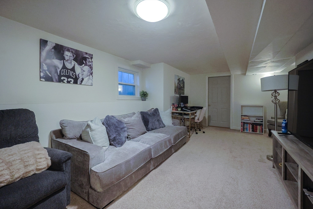 182 Summer Street Framingham, MA 01701 - Photo 26 of 30 a living room with furniture and a flat screen tv
