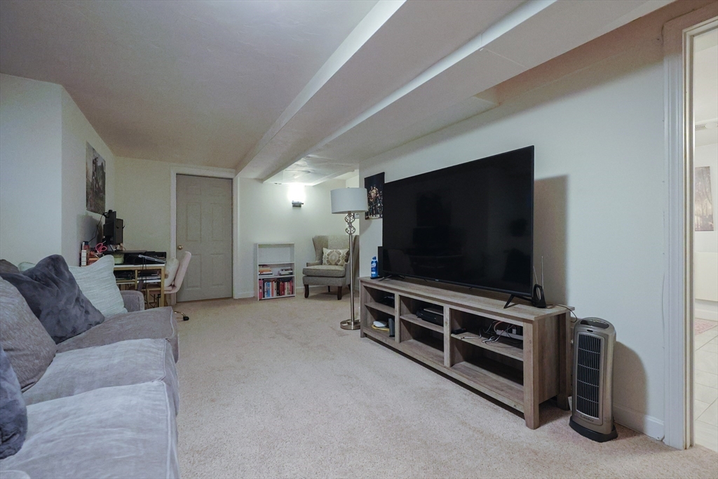 182 Summer Street Framingham, MA 01701 - Photo 27 of 30 a living room with furniture and a flat screen tv