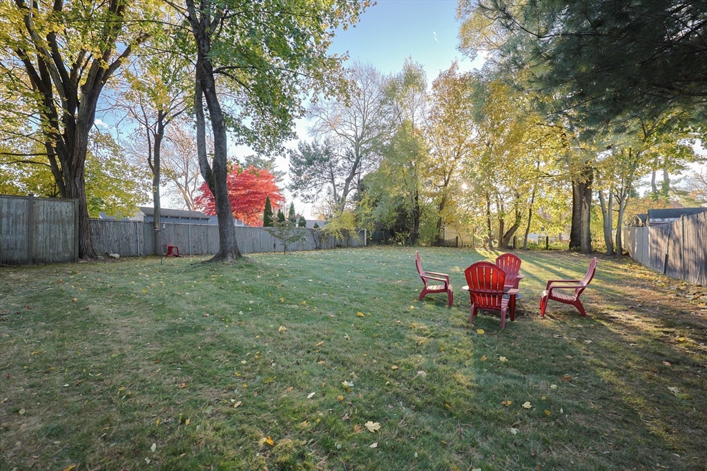 182 Summer Street Framingham, MA 01701 - Photo 29 of 30 a view of a backyard with table and chairs and a large tree
