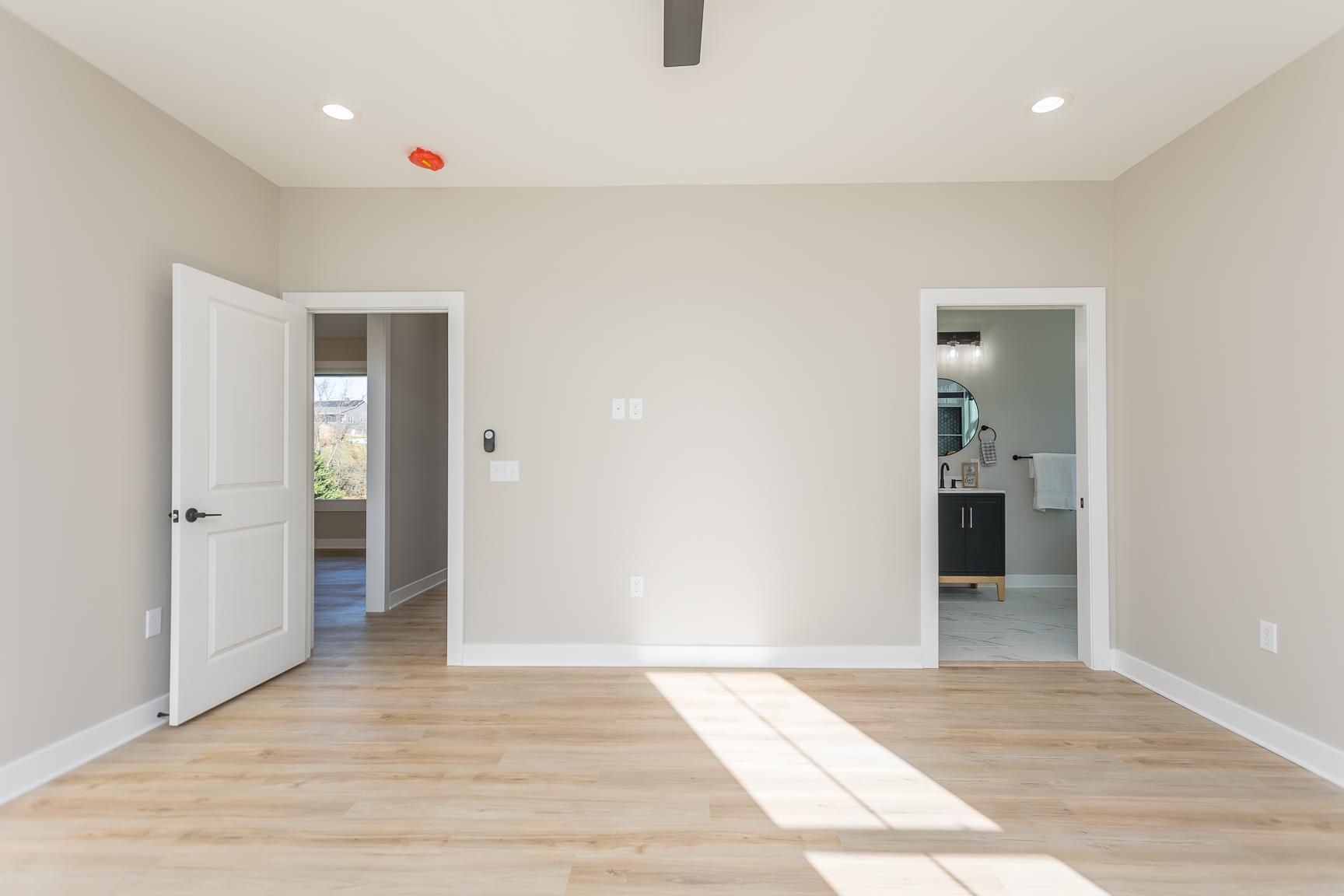 123 Willow Drive Dayton, VA 22821 - Photo 27 of 44 an empty room with wooden floor and bathroom
