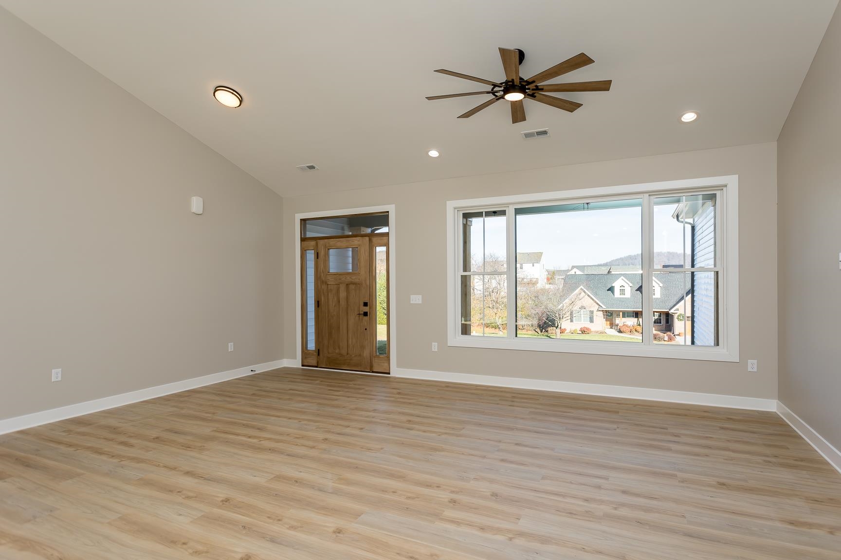 123 Willow Drive Dayton, VA 22821 - Photo 10 of 44 a view of an empty room with a window and wooden floor