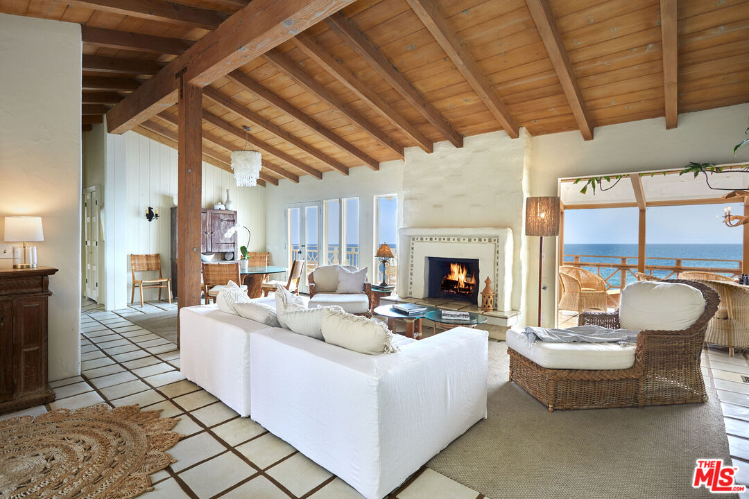 25110 Malibu Road Malibu, CA 90265 - Photo 12 of 28 a living room with furniture and a fireplace