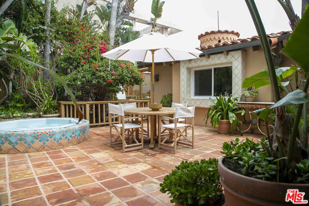 25110 Malibu Road Malibu, CA 90265 - Photo 8 of 28 a view of a house with backyard sitting area and garden