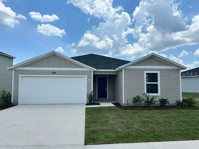 a front view of house with garden