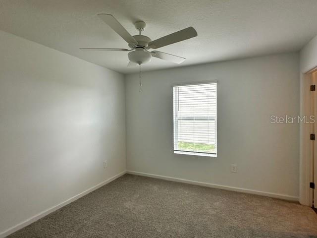 4534 Southwest 84th St Road Ocala, FL 34476 - Photo 14 of 31 an empty room with a window and a fan