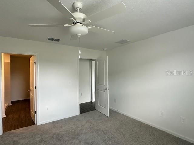 4534 Southwest 84th St Road Ocala, FL 34476 - Photo 16 of 31 an empty room with a ceiling fan and bathroom