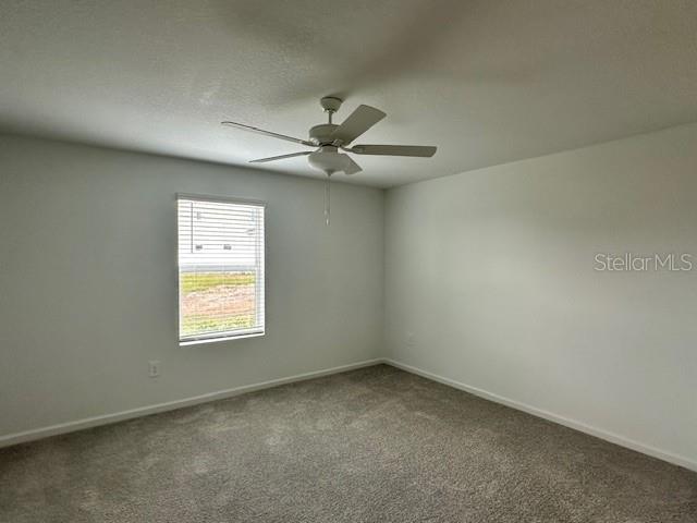 4534 Southwest 84th St Road Ocala, FL 34476 - Photo 17 of 31 an empty room with a window and a ceiling fan