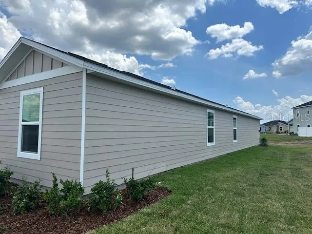 a backyard of a house with lots of green space