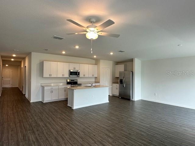 4534 Southwest 84th St Road Ocala, FL 34476 - Photo 22 of 31 a kitchen with a refrigerator and a microwave