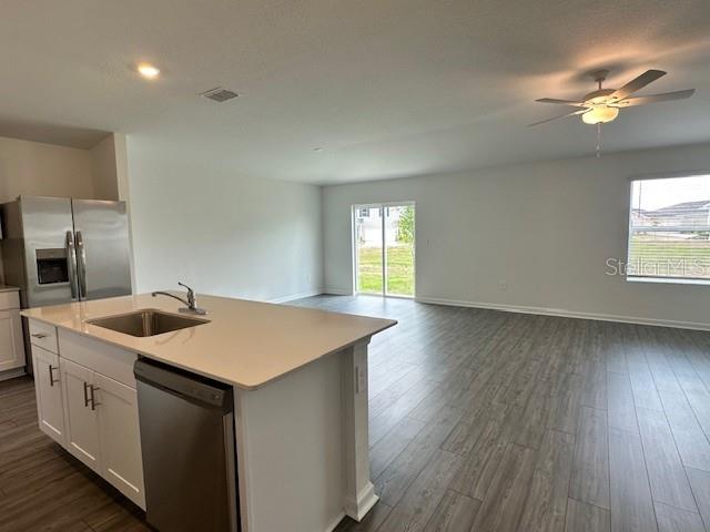 4534 Southwest 84th St Road Ocala, FL 34476 - Photo 28 of 31 a kitchen with a wooden floor and white appliances