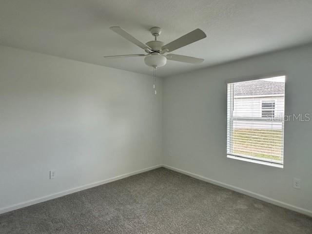 4534 Southwest 84th St Road Ocala, FL 34476 - Photo 10 of 31 an empty room with a window and a fan